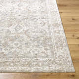 Close up of the Tyren Area Rug showing cream, light slate, and tan colors with a traditional pattern. Front