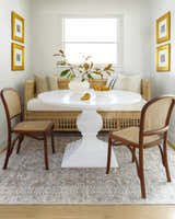 Dining nook with a white table and the tan, gray Tisha Washable Area Rug. Farmhouse style. Roomscene-Rectangle