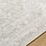 Close-up of the beige and ivory Tanko Washable Wool Area Rug showing texture and subtle traditional pattern. Texture