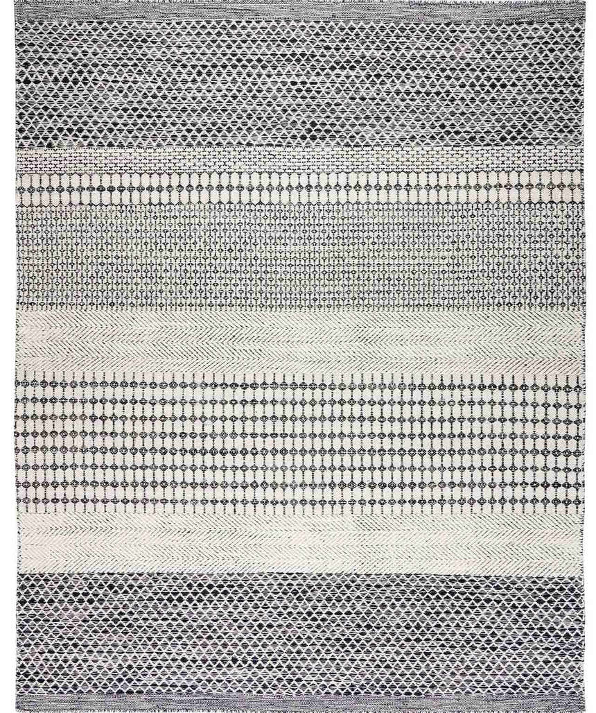 Close-up of the Tideswell Scandi Boho Wool Carpet. Beige rug with black geometric patterns and hand-woven texture. Design-Rectangle