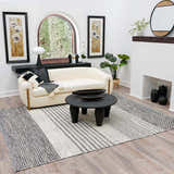 Living room scene with a Tideswell Scandi Boho Wool Carpet, cream sofa, black coffee table, and neutral decor. Roomscene-Rectangle
