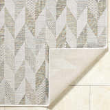 Close-up of Andrea Ivory Area Rug showing geometric pattern, ivory, sage, and sandstone colors, and polypropylene texture. Fold