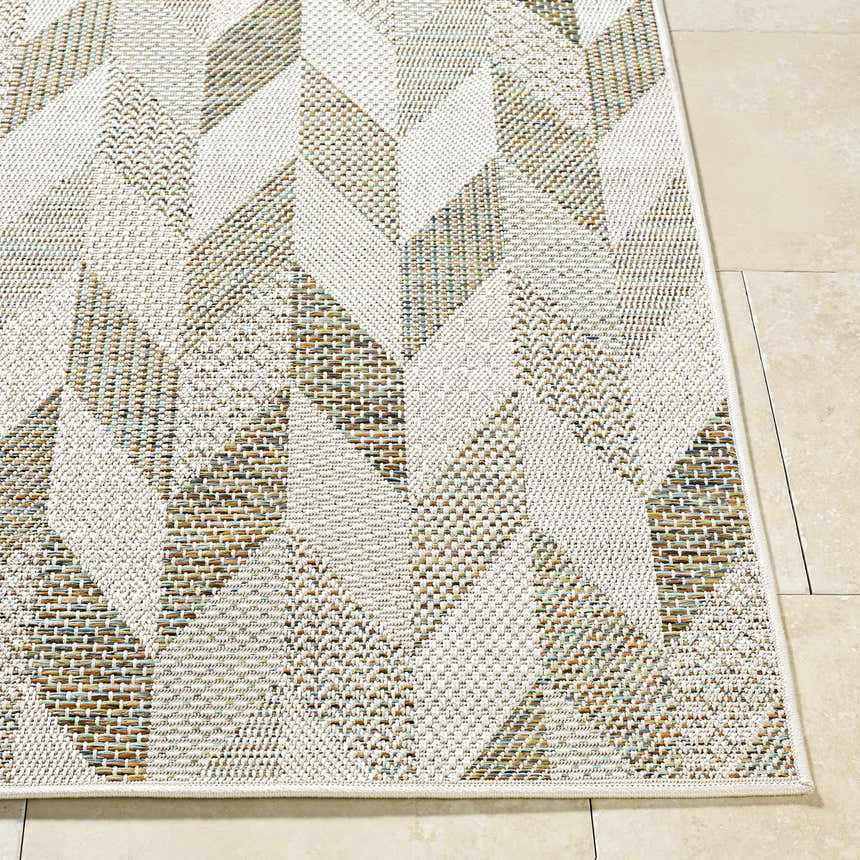 Close up of the Andrea Ivory Area Rug showing its woven texture and geometric ivory, sage, and sandstone pattern. Front