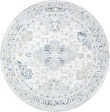 Close-up of the round Tana Washable Area Rug in Arctic Stone, featuring a traditional, faded medallion pattern. Design-Round-67