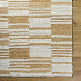 Close-up of Kamey Handmade Becki Owens x LIVABLISS BOKY-2307 Area Rug. Jute rug with ivory, sandstone, and yellow geometric pattern. Corner