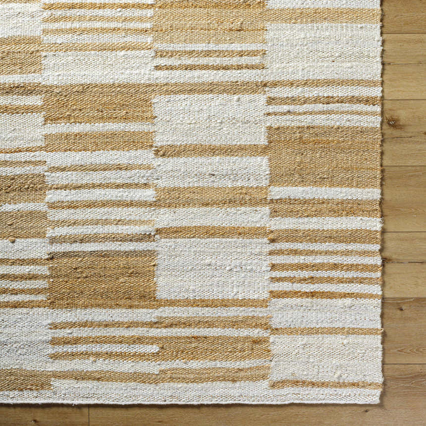 Close-up of Kamey Handmade Becki Owens x LIVABLISS BOKY-2307 Area Rug. Jute rug with ivory, sandstone, and yellow geometric pattern. Corner