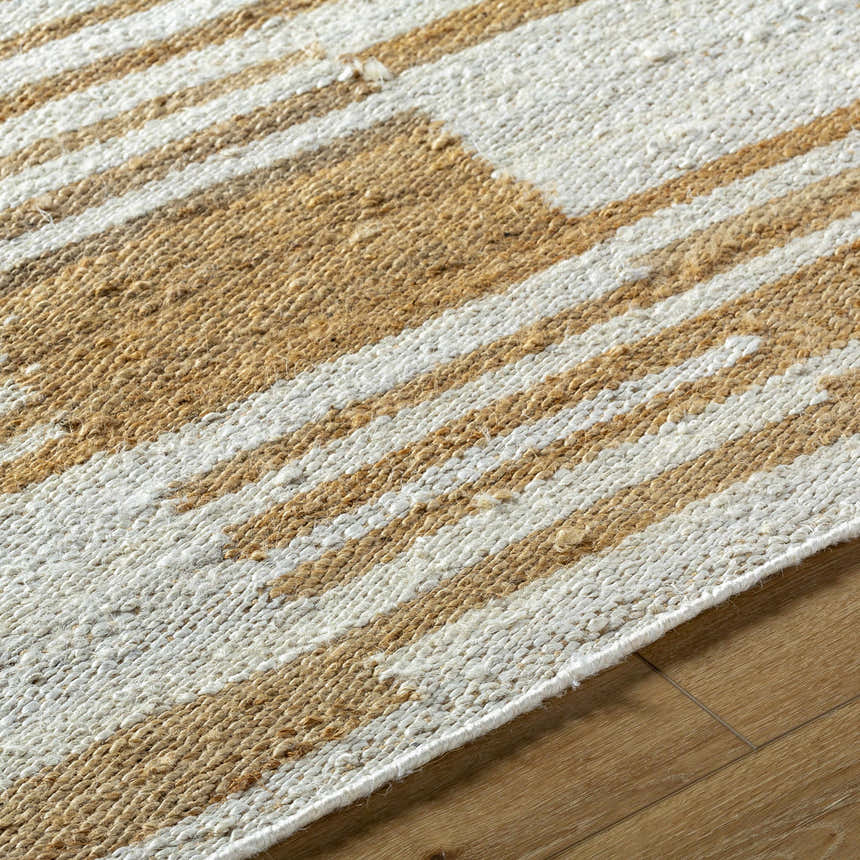 Close-up of Kamey Handmade Becki Owens x LIVABLISS BOKY-2307 Area Rug. Jute rug with ivory, sandstone, and yellow stripes. Texture