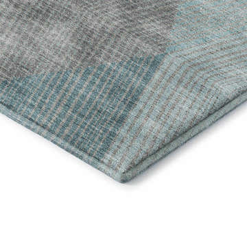 Close-up of the Dalyn Luxury Indoor/Outdoor The Reserve TR11 Turquoise Washable Area Rug, showing geometric pattern and texture.