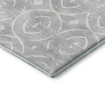 Close-up of Dalyn Luxury The Reserve TR12 Silver Washable Area Rug. Geometric pattern in silver gray and white.