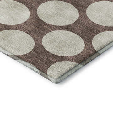 Close up of Dalyn Luxury The Reserve TR13 Coffee Washable Area Rug showing beige circles on a textured coffee background.