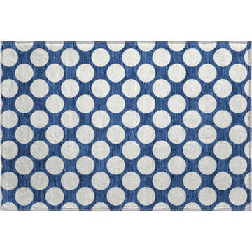 Close-up of the Dalyn Luxury The Reserve TR13 Navy Washable Area Rug with a white polka dot pattern.