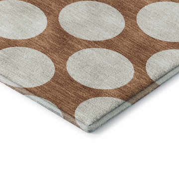Close up of the Dalyn Luxury Reserve TR13 Paprika Washable Area Rug. Beige circles on a paprika geometric pattern.