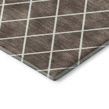 Close-up of Dalyn Luxury The Reserve TR15 Brown Washable Area Rug. Beige grid on dark brown geometric pattern.
