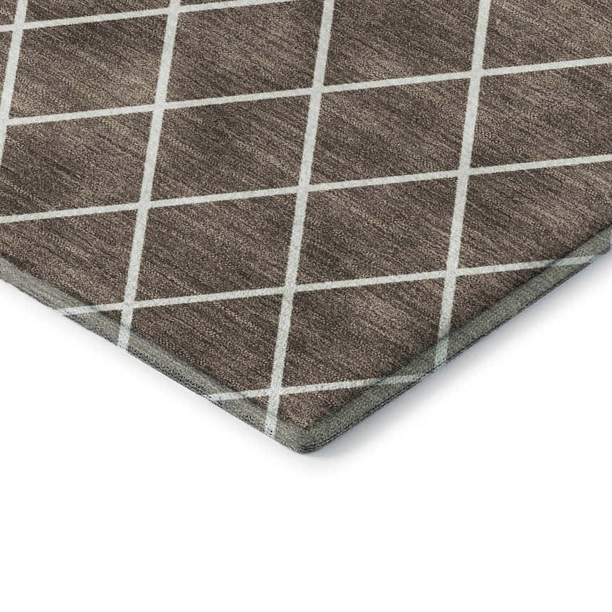 Close-up of Dalyn Luxury The Reserve TR15 Brown Washable Area Rug. Beige grid on dark brown geometric pattern.