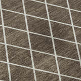 Close-up of Dalyn Luxury The Reserve TR15 Brown Washable Area Rug. Geometric design with dark brown and beige tones.