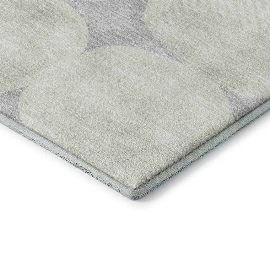 Close-up of the Dalyn Luxury The Reserve TR16 Gray Washable Area Rug showing geometric beige and gray pattern and soft texture.
