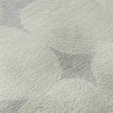 Close-up of the Dalyn Luxury The Reserve TR16 Gray Washable Area Rug, featuring a geometric pattern and soft texture.