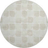 Close-up of round Dalyn Luxury The Reserve TR16 Ivory Washable Area Rug with beige geometric pattern.