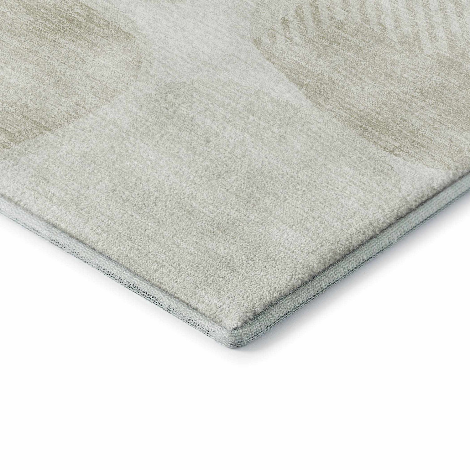 Close-up of the Dalyn Luxury Indoor/Outdoor The Reserve TR16 Ivory Washable Area Rug, showing texture and geometric pattern.