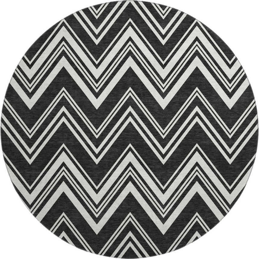 Close-up of round Dalyn Luxury The Reserve TR17 Black Washable Area Rug with black and off white geometric chevron pattern.