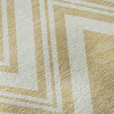 Close-up of the Dalyn Luxury The Reserve TR17 Honey Washable Area Rug, featuring a geometric pattern in yellow and white.