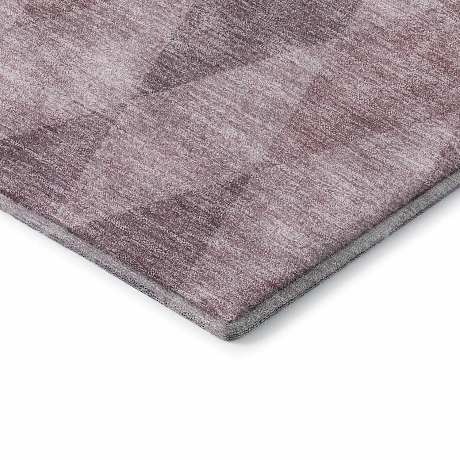 Close-up of the Dalyn Luxury Indoor/Outdoor The Reserve TR2 Blush Washable Area Rug, showing a geometric pattern in blush pink hues.