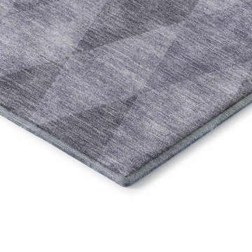 Close-up of the Dalyn Luxury The Reserve TR2 Lavender Washable Area Rug, showing its dark and light purple geometric pattern.