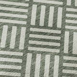 Close-up of Dalyn Luxury The Reserve TR3 Basil Washable Area Rug showing geometric pattern and basil and chestnut colors.