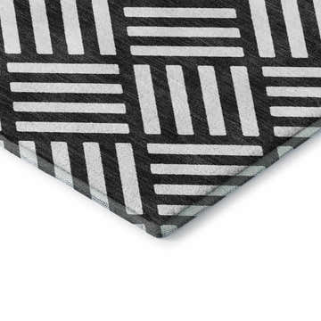 Close-up of Dalyn Luxury The Reserve TR3 Black Washable Area Rug with a geometric black and off-white pattern.