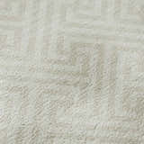 Close-up of the beige Dalyn Luxury Indoor/Outdoor The Reserve TR5 rug, showing geometric pattern and soft texture.