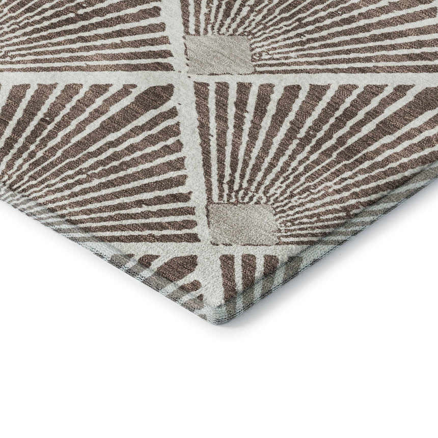 Close-up of the geometric Dalyn Luxury Indoor/Outdoor The Reserve TR9 Brown Washable Area Rug. Beige and dark brown tones.