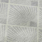 Close-up of the Dalyn Luxury Indoor/Outdoor The Reserve TR9 Silver Washable Area Rug featuring a geometric silver and white pattern.