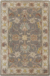 Close-up of the Cherryfield Hand Tufted Taupe Wool Rug, showcasing its floral pattern, texture, and colors: taupe, beige, and yellow. Design-Rectangle-23