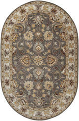 Close-up of the oval Cherryfield Hand Tufted Taupe Wool Rug featuring a floral pattern in taupe, beige, brown, and yellow. Design-Oval-69