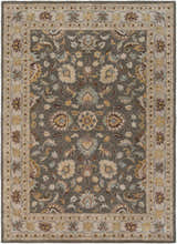 Close-up of the Cherryfield Hand Tufted Taupe Wool Rug. Features a traditional floral pattern in taupe, beige, brown, and yellow tones. Design-Rectangle-811