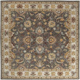 Close-up of the Cherryfield Hand Tufted Taupe Wool Rug. Features a floral pattern in taupe, brown, yellow, and beige hues. Design-Square-8