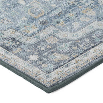 Close-up of the corner of a Dalyn Tuscany TU4 Blue Area Rug, showcasing its beige, blue, and ivory traditional pattern.