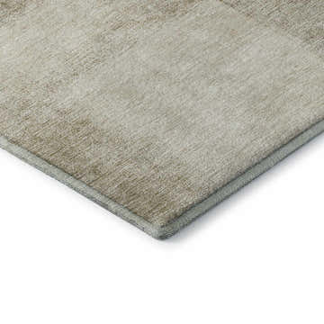 Close-up of the Dalyn Luxury Indoor/Outdoor Trevi TV10 Taupe Washable Area Rug showing its beige and tan textured design.