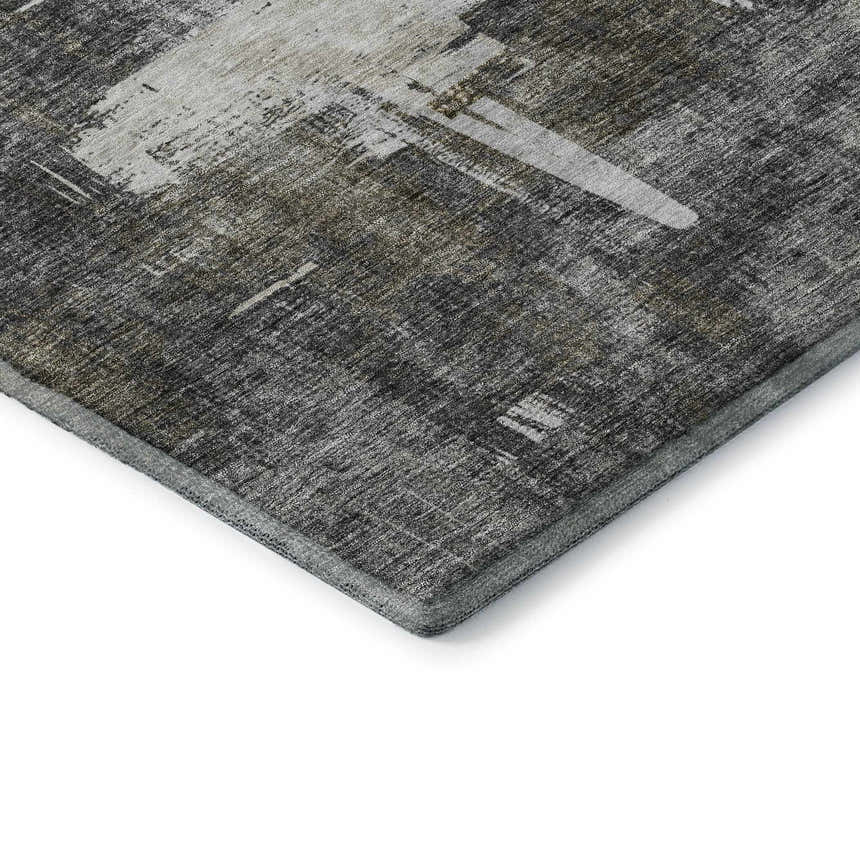 Close-up of the Dalyn Luxury Trevi TV18 Gray Washable Area Rug, showing its gray, ivory, and taupe abstract pattern.