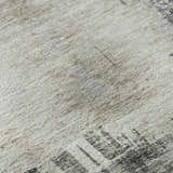 Close-up of the Trevi TV18 Gray Washable Area Rug, showing its gray, ivory, and taupe colors and textured pattern.