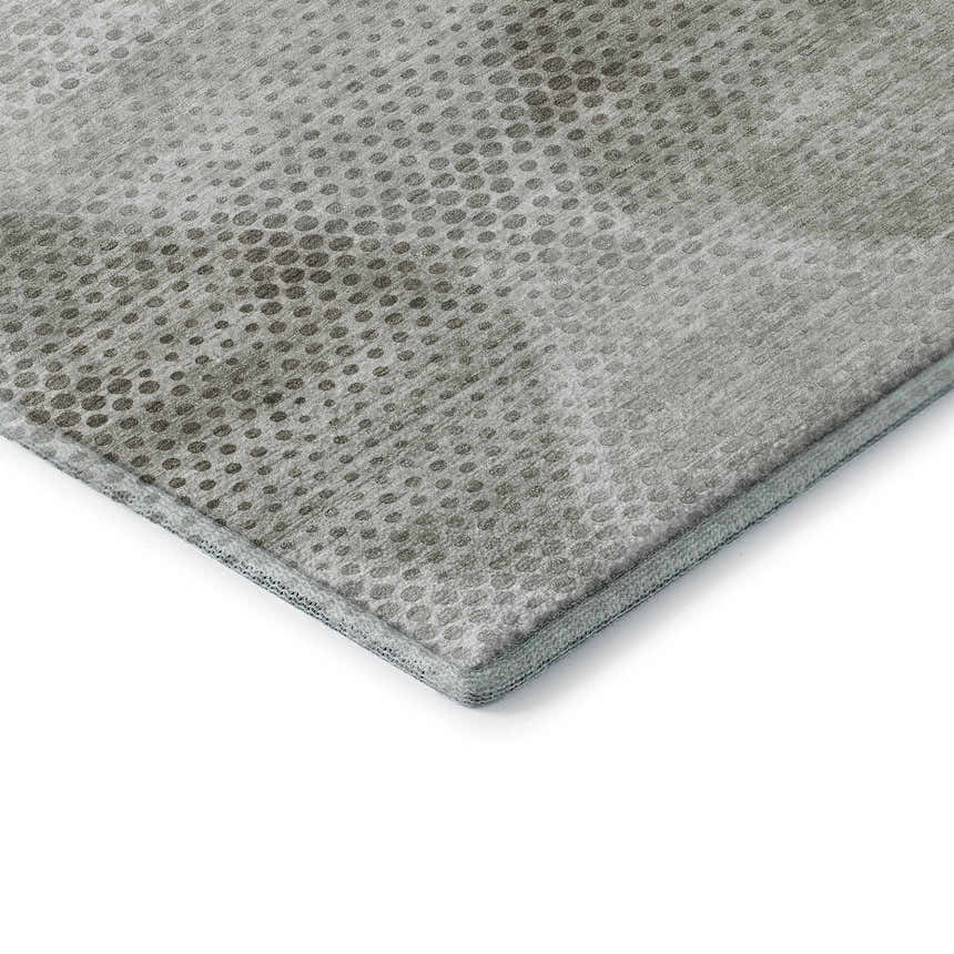 Close-up of the Dalyn Luxury Indoor/Outdoor Trevi TV4 Gray Washable Area Rug with a textured dot pattern.