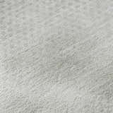 Close-up of the ivory Dalyn Luxury Trevi TV4 rug, showing its subtle dotted pattern and soft, textured weave.