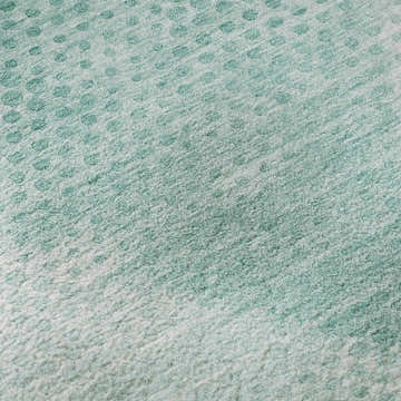 Close up of the teal Dalyn Luxury Trevi rug with a textured, dotted pattern and a soft, washable surface.