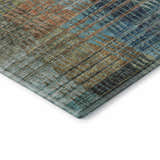 Close-up of Dalyn Luxury Trevi TV6 Green Washable Area Rug. Features a plaid pattern with green, blue, and brown hues.