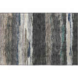 Close-up of a Dalyn Luxury Trevi TV8 Black Washable Area Rug with beige, black, green, and gray vertical brushstroke pattern.