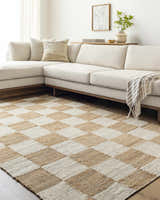 Living room scene with a Kamey Handmade Becki Owens x LIVABLISS rug in a light brown and white checkerboard pattern. Beige sectional sofa. Roomscene-Rectangle
