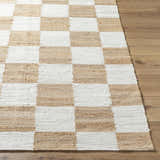 Close-up of the Kamey Handmade Becki Owens x LIVABLISS rug. Jute rug with a light brown and white checkerboard pattern. Front