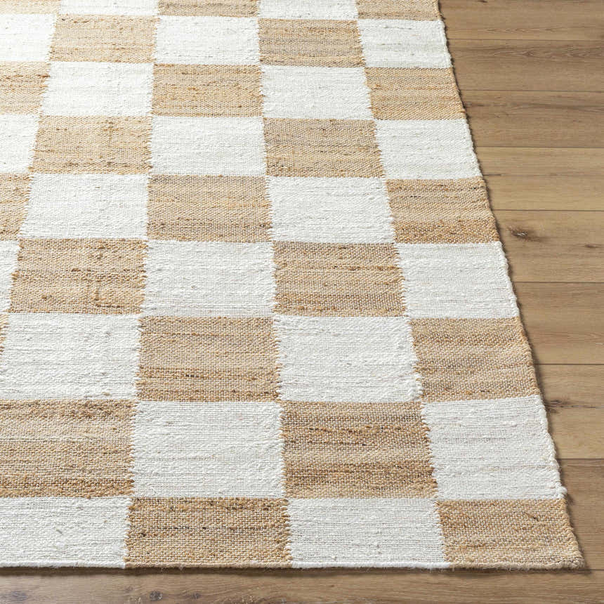 Close-up of the Kamey Handmade Becki Owens x LIVABLISS rug. Jute rug with a light brown and white checkerboard pattern. Front