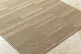 Close-up of the Thana Brown Area Rug showing its camel, tan, and prairie dust woven texture and rectangular shape. Corner
