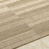 Close-up of the Thana Brown Area Rug featuring a textured, striped pattern in camel, prairie dust, and tan hues. Texture
